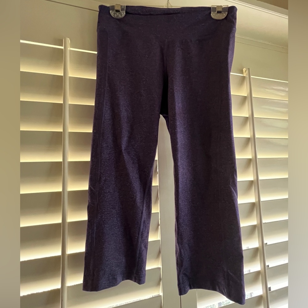Active woman’s athletic capris in purple.